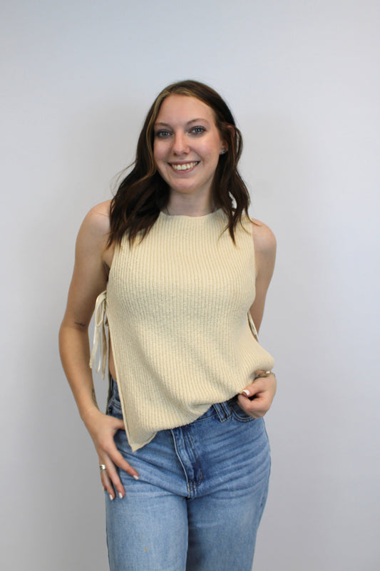 sleeveless sweater with tied open sides