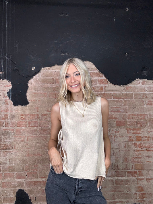 sleeveless sweater with tied open sides